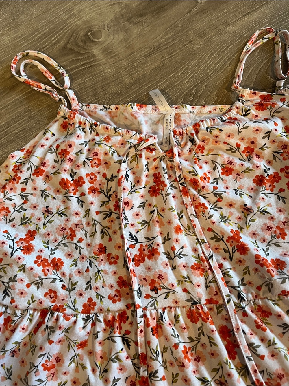 French twist keyhole / tie flowy tiered top. Orange floral Print on white. L-XL